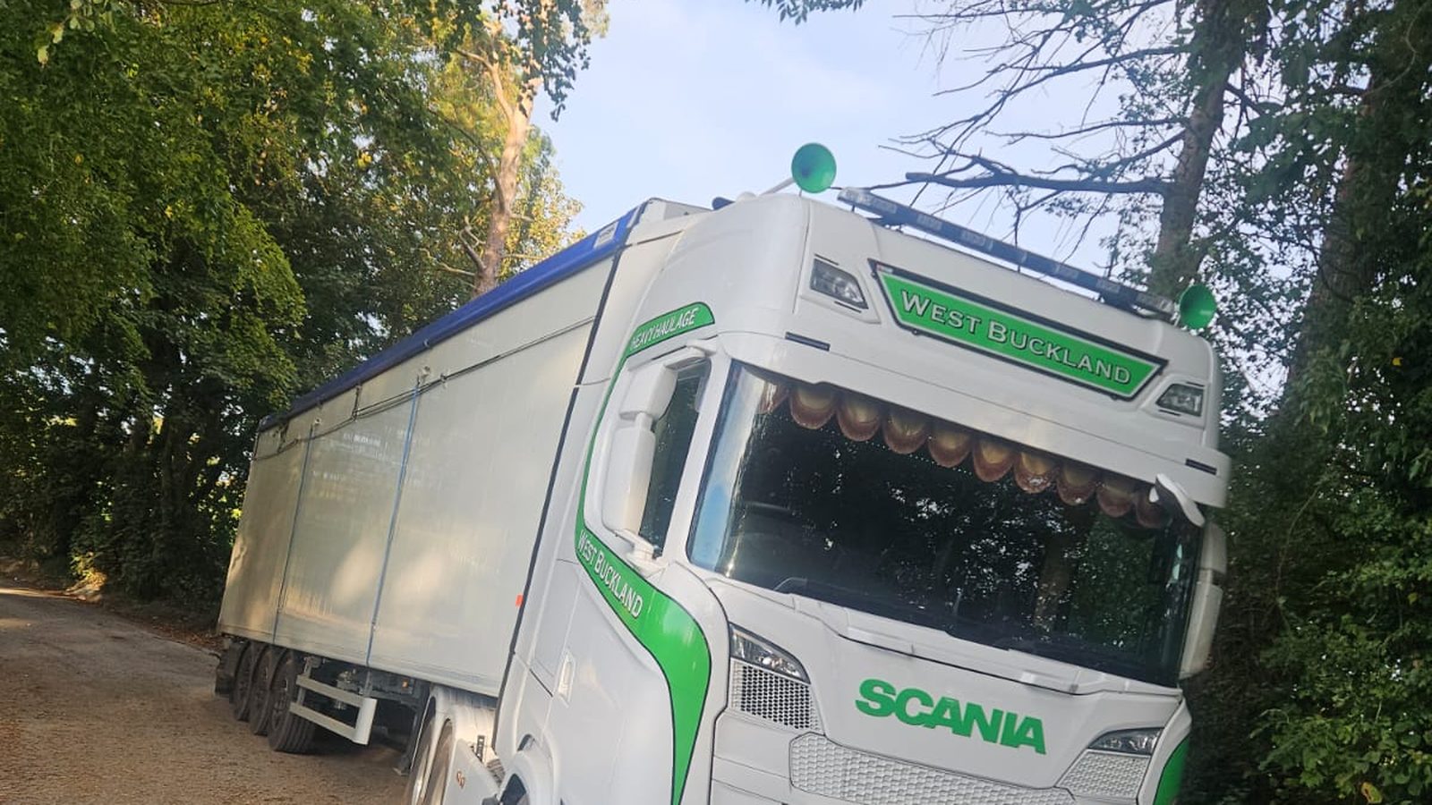 West Buckland Haulage Scania walking floor lorry on a narrow tree-lined country lane